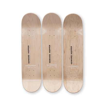 Three natural wood skateboards featuring "City Roofs" by Edward Hopper with minimalist branding from The Skateroom.