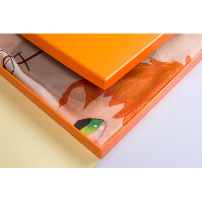 Close-up of the “Rules” design object by Javier Calleja showing vibrant colors and partial orange frame on cream background.