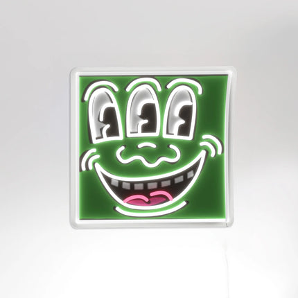 Full artwork view of neon light design "Triple Eyes YP x Keith Haring" featuring a smiling face with three eyes by Keith Haring.